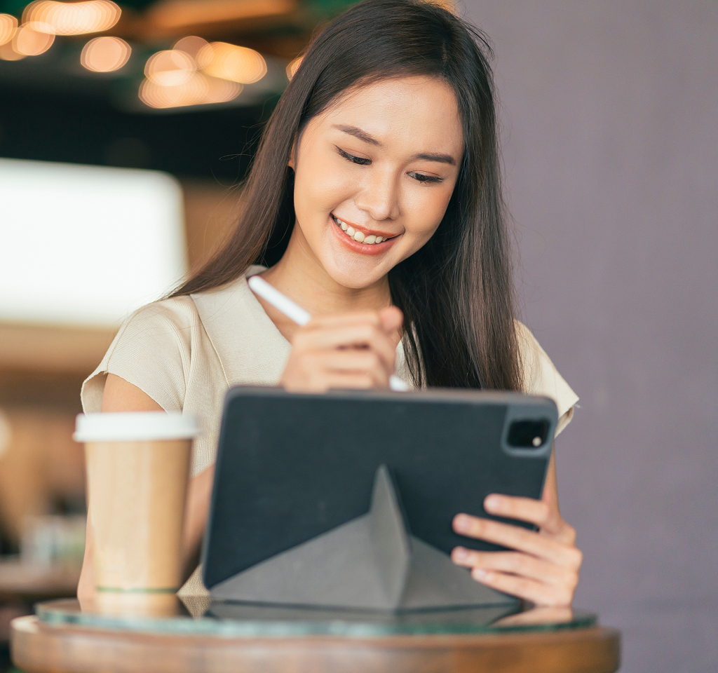 Asian female freelancer working remotely on a laptop — Filipino offshore professional